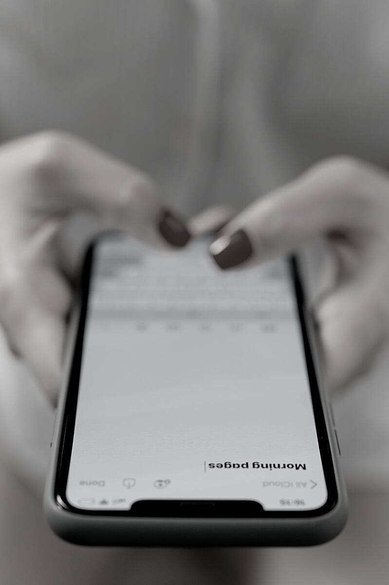 Woman Typing a Note in Mobile Phone